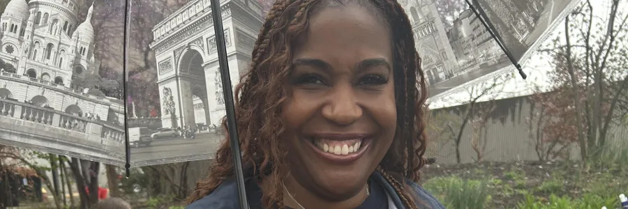 A woman at an AFGE rally wearing a Our Rights | Our Voice | Our Right shirt